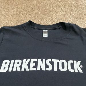 BIRKENSTOCK T-SHIRT SIZE SMALL BLACK W/ WHITE CHEST & SLEEVE LOGO STAFF ITEM?